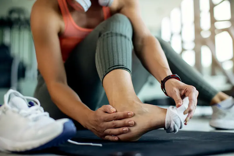 closeup-athletic-woman-injured-her-foot-workout-gym Lateral Ankle Ligament Reconstruction
